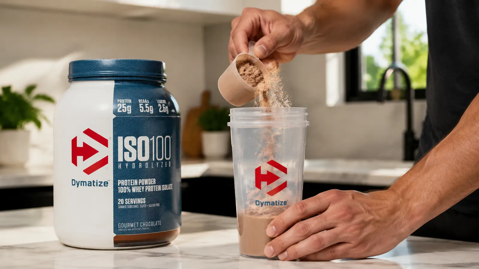 Close-up of a scoop of ISO100 Gourmet Chocolate powder being measured over a shaker cup